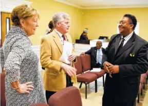  ??  ?? From left, Margaret Thompson and John Martin of Fletcher Bright Realty talk with Pastor Jeffrey Jefferson at the dedication of The Ark Church at its new location. The Realtors helped find a new home for the church, formerly First Baptist of Lookout...