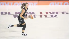  ?? Phelan M. Ebenhack / Associated Press ?? New York Liberty forward Sabrina Ionescu pushes the ball up the court during the first half of a WNBA game against the Seattle Storm on Saturday.