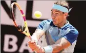  ?? PTI ?? Rafael Nadal returns the ball to John Isner during their match at the Italian Open tennis tournament, in Rome, Wednesday