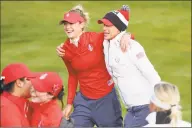  ?? Peter Morrison / Associated Press ?? Nelly Korda, left, of the U.S. celebrates with team captain Juli Inkster on the 18th green after finishing all square against Europe during their fourballs match in the Solheim Cup at Gleneagles, Auchterard­er, Scotland on Friday.