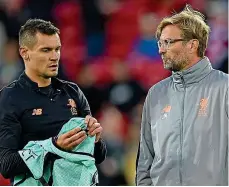  ??  ?? No case for the defence: Klopp with Dejan Lovren, who is often criticised for his part in a leaky back four GETTY IMAGES