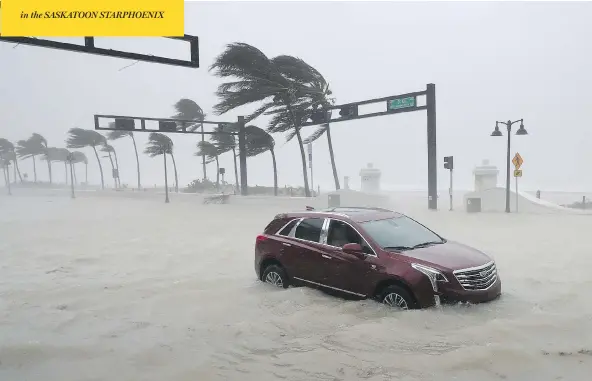  ?? CHIP SOMODEVILL­A / GETTY IMAGES ?? A car sits abandoned in storm surge in Fort Lauderdale, Fla., as hurricane Irma hit the southern part of the state on Sunday after raking across the north coast of Cuba.