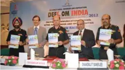  ??  ?? Lt General S.P. Kochhar (centre) releasing the brochure of DEFCOM 2012