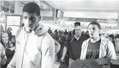  ??  ?? LiAngelo Ball (right) and Cody Riley arrive at LAX after flying back from China where they were detained on suspicion of shopliftin­g, in Los Angeles, California. — Reuters photo