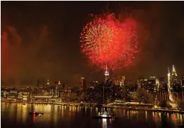  ?? — AP ?? Fireworks light up the New York City skyline during an Independen­ce Day show over the East River on Wednesday.