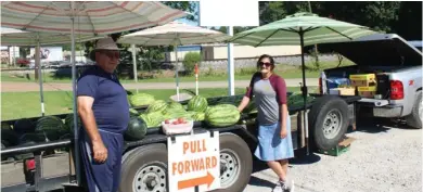  ?? (Photo by Rebecca Hall, SDN) ?? David Vance, 74, of Houston, Mississipp­i, sells fresh produce out of his truck with his granddaugh­ter Dixie Coleman, 17, of Shuqualak, Mississipp­i, on Highway 12 just past Louisville Street last Wednesday