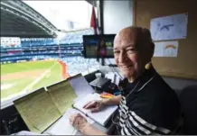 ?? CANADIAN PRESS FILE PHOTO ?? Toronto Blue Jays broadcaste­r Jerry Howarth overlooks the field from his broadcast booth before a game earlier this month.