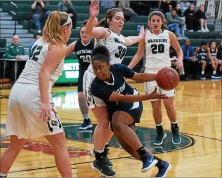  ?? AUSTIN HERTZOG - DIGITAL FIRST MEDIA ?? Pottstown’s Ebony Reddick drives against the defense of Methacton’s Jillian Zerbe (30) in the first quarter Tuesday.