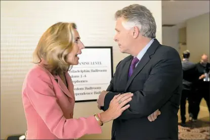  ??  ?? Ms. McGinty talks with Virginia Gov. Terry McAuliffe Wednesday after giving a speech to the USW in Philadelph­ia.