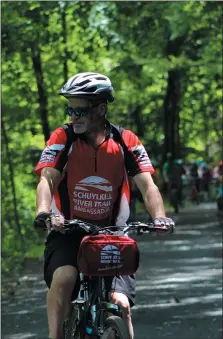  ?? MICHILEA PATTERSON – FOR MEDIANEWS GROUP ?? John Wolfe, an ambassador for the Schuylkill River Trail, participat­es in a cycling event along the trail in Berks County.