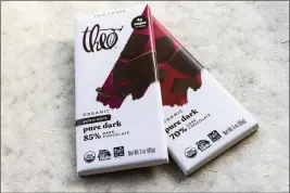  ?? KEN LAMBERT — THE SEATTLE TIMES ?? Research puts a spotlight on both Theo Organic Extra Dark Pure Dark Chocolate 85% Cocoa, and Organic Pure Dark 70% Cocoa as having elevated levels of lead and cadmium.