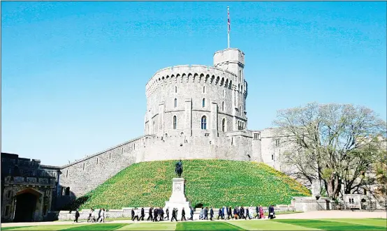  ??  ?? In this April 20, 2018 file photo, leaders of Commonweal­th countries arrive and walk past the round tower at Windsor Castle for the second day of the Commonweal­th Heads of Government 2018
for a behind closed doors meeting in Windsor, England. (AP)