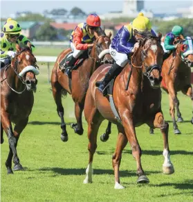  ?? Picture: Wayne Marks ?? DODDLE: Rainbow Bridge and jockey Bernard Fayd’Herbe win the Cape Mile at Kenilworth yesterday. Long-time leader Silver Maple, left, hung on for second place, while Eyes Wide Open, between them, was fifth.