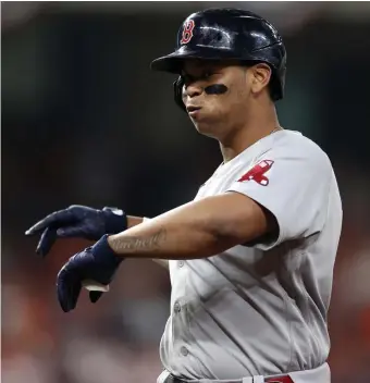  ?? GETTy IMaGES ?? LOOKING UP: Third baseman Rafael Devers looks to the dugout after singling in the first inning of Friday’s ALCS game against the Houston Astros.