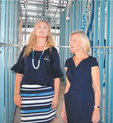  ?? Picture: DANIEL BATEMAN ?? ALMOST THERE: Wellness Centre general manager Kelli Beardsmore and COUCH co-founder Pip Woodward take a walk-through of the new centre’s site at Kauri St, Manoora.