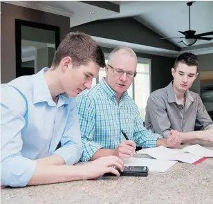  ?? RICHARD LAM/POSTMEDIA NEWS ?? Credit Counsellin­g Society president-CEO Scott Hannah, with sons Pearce, left, and Connor, says it’s important for parents not to simply bail teens out of financial jams.