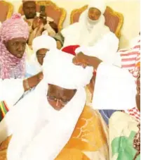  ?? PHOTOS: ?? Alhaji Dalhatu being turbaned as Waziri Aliyu M. Hamagam