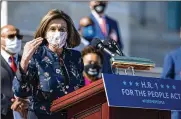  ?? ANNA MONEYMAKER / NEW YORK TIMES ?? Speaker of the House Nancy Pelosi (D-Calif.) addresses an event promoting H.R. 1, Wednesday on the steps of the Capitol in Washington. The For the People Act of 2021 deals with federal voter rights.