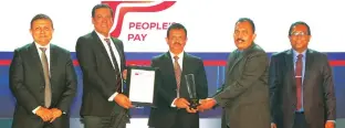  ?? ?? Receiving Gold award for ‘Best Mobile Applicatio­n for Retail Payments via LankaQR (Banks and Non-Bank Financial Institutio­ns) - People’s Pay