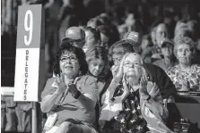  ?? Michael Wyke/Contributo­r ?? Senate District 9 delegates Carla Gonzales, left, and Lois Kapp, right, applaud speakers Saturday during the final day of this year’s Republican Party of Texas Convention in Houston.