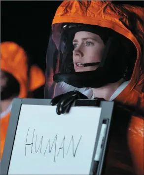  ??  ?? Amy Adams puts in a mesmerisin­g performanc­e as Louise Banks in Arrival.