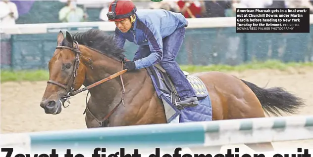  ?? CHURCHILL DOWNS/REED PALMER PHOTOGRAPH­Y ?? American Pharoah gets in a final workout at Churchill Downs under Martin Garcia before heading to New York Tuesday for the Belmont.