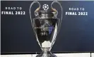  ?? Coffrini/AFP/Getty Images ?? The Champions League on display before the draw in Nyon on Friday. Photograph: Fabrice