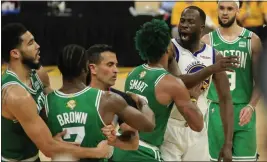  ?? SHAE HAMMOND — BAY AREA NEWS GROUP ?? The Warriors' Draymond Green argues with the Celtics' Jaylen Brown and Marcus Smart during Sunday's game.