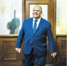  ?? ERNEST DOROSZUK/POSTMEDIA NEWS ?? Doug Ford, the newly elected leader of the Progressiv­e Conservati­ve Party of Ontario, leaves the party offices after a brief visit to Queen’s Park in Toronto on Monday.