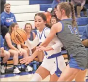  ?? Scott Herpst ?? Ringgold’s Cady Helton drives against Bremen’s Marley Derringer during Friday’s game in Ringgold. The Lady Tigers overcame a nine-point halftime deficit to beat the Lady Devils, 41-40, in a Region 6-AAA contest.