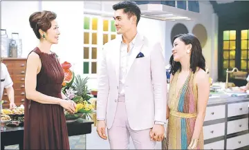  ??  ?? (From left) Tan Sri Michelle Yeoh, Henry Golding and Constance Wu in a scene from ‘Crazy Rich Asians’. — Photo courtesy of Warner Bros. Pictures