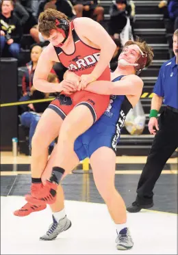  ?? Christian Abraham / Hearst Connecticu­t Media ?? Staples’ Nicholas Augeri lifts Fairfield Warde’s Griffin Gallati off the mat during the Class LL state championsh­ip in 2020.