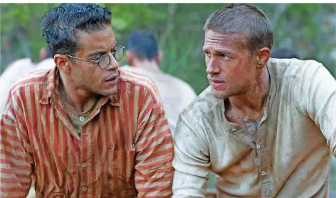  ?? FOTO: CONSTANTIN FILM VERLEIH/DPA ?? Planen ihre Flucht aus der Strafkolon­ie: Charlie Hunnam (rechts) als „Papillon“und Rami Malek als Dega.