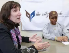  ??  ?? A HELPING HAND: The Wily Network executive director Judi Alperin King talks about the organizati­on’s mission to help college students like Eric James, right, who do not have family support.