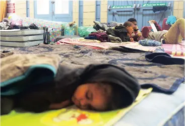  ?? Picture: COURTNEY AFRICA ?? NOTHING LEFT: Alonsa Mcdonald lies on a mattress donated to her family after their home was destroyed by a fire.