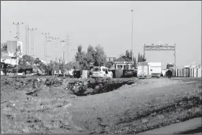  ?? AP/ RAAD ADAYLEH ?? Ambulances leave the King Abdullah bin Al Hussein Training Center where a Jordanian policeman opened fi re in Mwaqar on the outskirts of Amman, Jordan, on Monday.