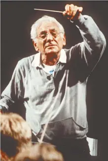  ?? AP-Yonhap ?? Leonard Bernstein leads the Schleswig-Holstein Music Festival Orchestra in Hamburg, Germany, in this July 1990 file photo.