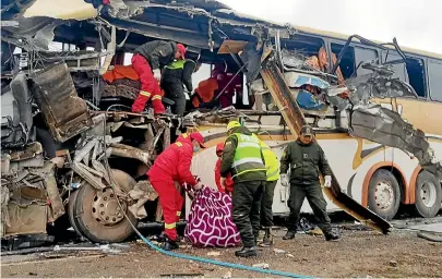  ?? AP ?? Twenty-one people died when this bus rolled and tumbled into a ravine. Among the survivors was Erwin Tumiri who survived a plane crash in Colombia five years ago.