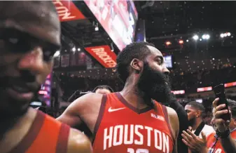  ?? Loren Elliott / Special to The Chronicle ?? The Rockets are facing a tipping point with reports of tensions between guards James Harden (center) and Chris Paul (left), who’s reportedly demanded a trade but will be hard to move.