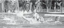  ?? GARY CURRERI/SPECIAL CORRESPOND­ENT ?? St. Thomas Aquinas senior Luka Vlasic scores one of his six goals against Gulliver Prep in the FHSAA boys state water polo semifinals at Belen Jesuit Preparator­y School on Friday. Gulliver Prep won the game 19-11 en route to winning the state championsh­ip.