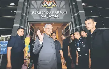  ??  ?? Dr Mahathir arrives for the National Finance Council meeting. — Bernama photo