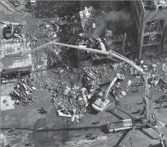  ?? NG HAN GUAN / AP ?? Firefighte­rs work the scene of an explosion in Sanhe in northern China’s Hebei province on Wednesday. Two people were killed and 26 others injured in the explosion.