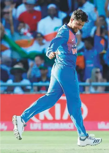  ?? AFP ?? India’s Kuldeep Yadav celebrates taking the wicket of England’s Joe Root during the internatio­nal Twenty20 cricket match between England and India at Old Trafford.