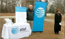  ?? Westside Eagle Observer/SUSAN HOLLAND ?? Cathy Foraker (right), AT&T director of external affairs, announces expanded high-speed Internet access to rural areas of Benton County. Ron Anderson (left), area manager for planning and engineerin­g, displays an informatio­n board showing how the AT&T...