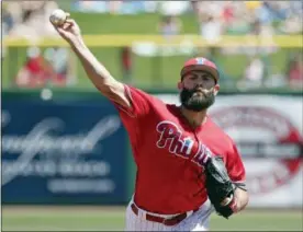  ?? JOHN RAOUX — THE ASSOCIATED PRESS ?? Phillies pitcher Jake Arrieta throws against the Pirates Tuesday.