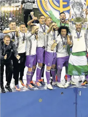  ??  ?? Real Madrid celebrate winning the Uefa Champions League final against Juventus at