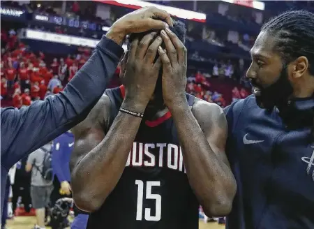  ?? Brett Coomer / Houston Chronicle ?? Center Clint Capela (15) is consoled by teammate Nene after the Rockets squandered an 11-point halftime lead to lose Game 7 of the NBA Western Conference finals 101-92 to the defending league champion Golden State Warriors on Monday at Toyota Center.
