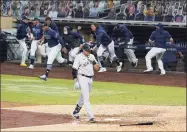  ?? Gregory Bull / Associated Press ?? The Yankees’ Gio Urshela walks back to the dugout after lining out for the final out in Game 5 on Friday.