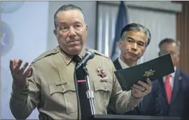  ?? Mel Melcon Los Angeles Times ?? SHERIFF VILLANUEVA with Atty. Gen. Rob Bonta in October. Bonta ordered the sheriff to “cease investigat­ive activity” into the hotline contracts.