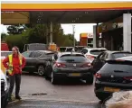  ?? ?? Pump panic...motorists queue for fuel in Kent